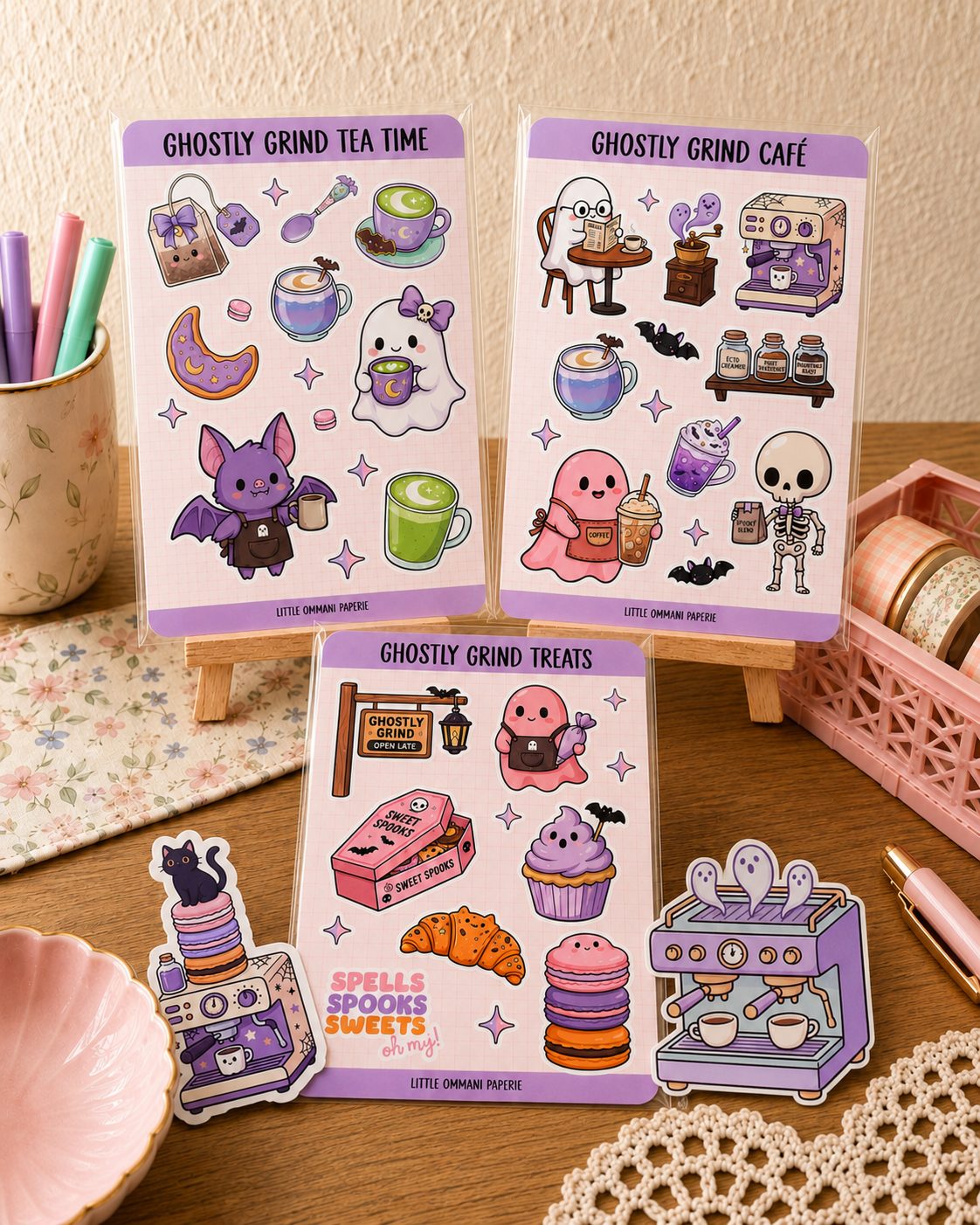 Ghostly Grind Treats, Tea Time, and Café sticker sheets displayed together with the Ghostly Espresso Machine and Midnight Cat Espresso die-cut stickers